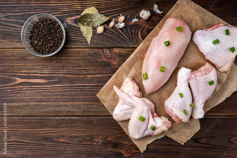 Raw chicken meat on dark wooden background. Raw chicken meat on dark wooden background.