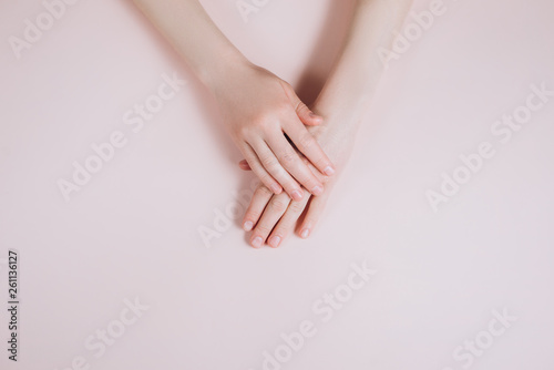 Beautiful Woman Hands with copy space on a beige background. Beauty cosmetic research and development concept. Top view