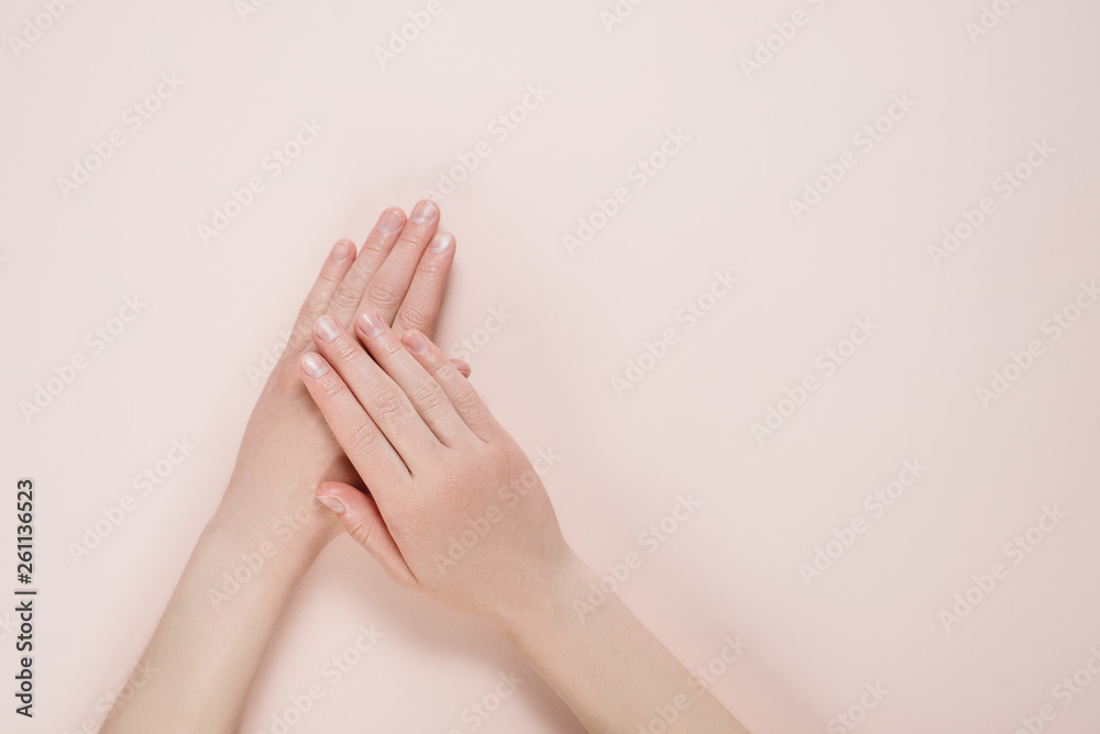 Beautiful Woman Hands with copy space on a beige background. Beauty cosmetic research and development concept. Top view Beautiful Woman Hands with copy space on a beige background. Beauty cosmetic research and development concept. Top view