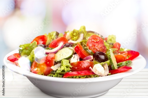 Photo of fresh salad with vegetables