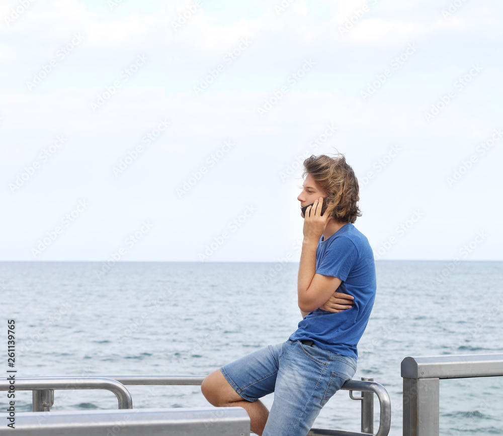 Teenage boy typing text message.Using smart phone. Teenage boy typing text message.Using smart phone.