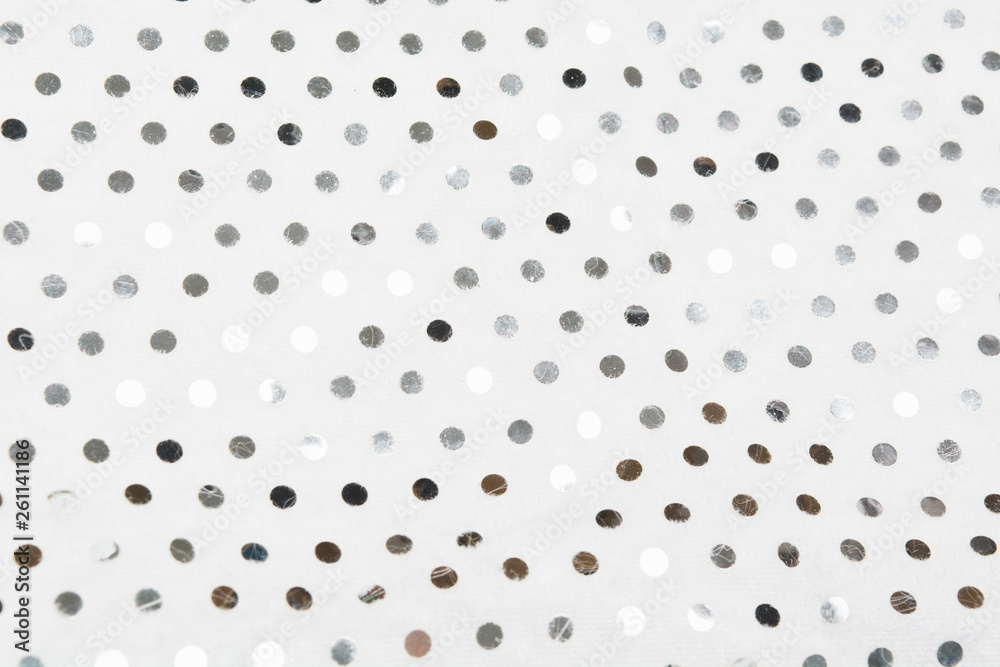 Silver sequins on white fabric textile material Silver sequins on white fabric textile material