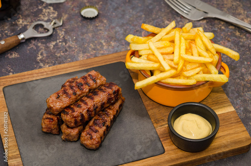 Grilled romanian meat rolls called mititei, mici - close-up. Romanian traditional food