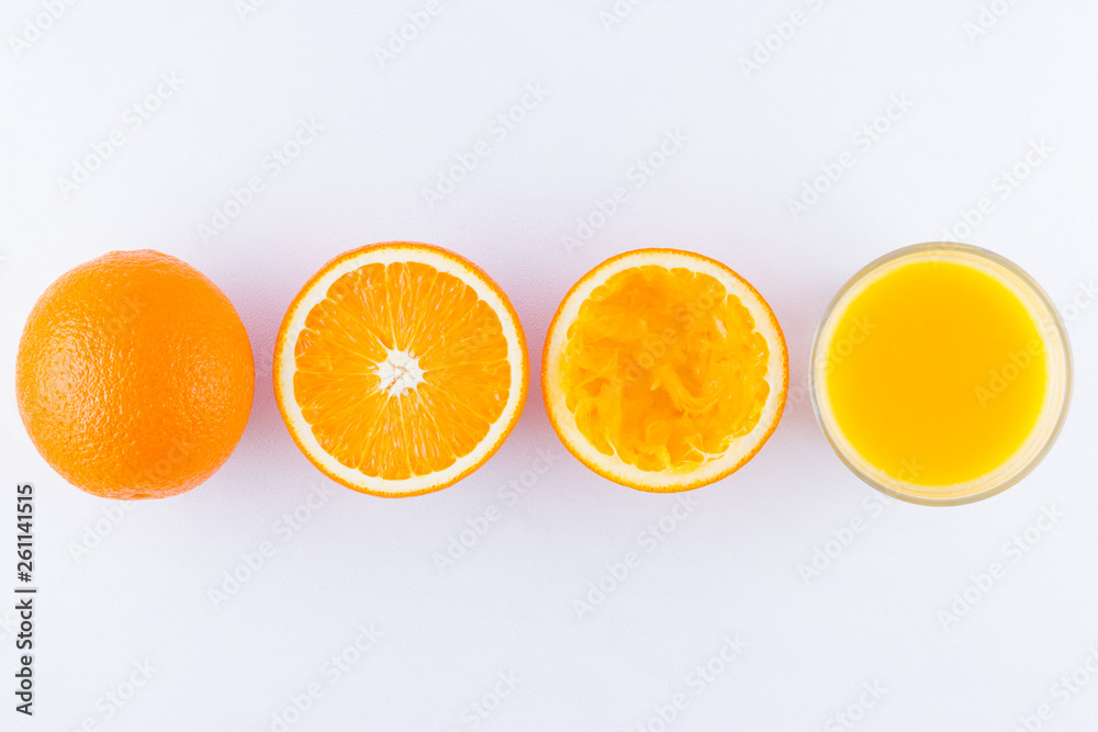 Orange fruits with juice, concept. Orange juice and halves of oranges on white background. Citrus for making juice. Whole and squeezed oranges and glass of juice