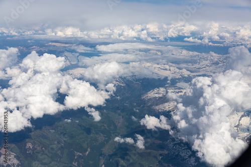 Fluffy white clouds, a view from airplane window