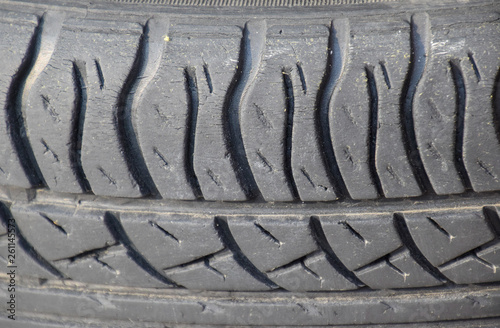 The background of the tread pattern of the car wheel. Rubber tir photo