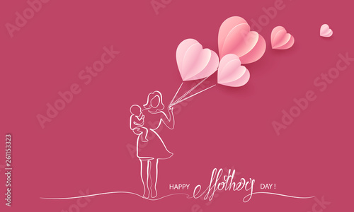 Woman hold her baby with air balloons