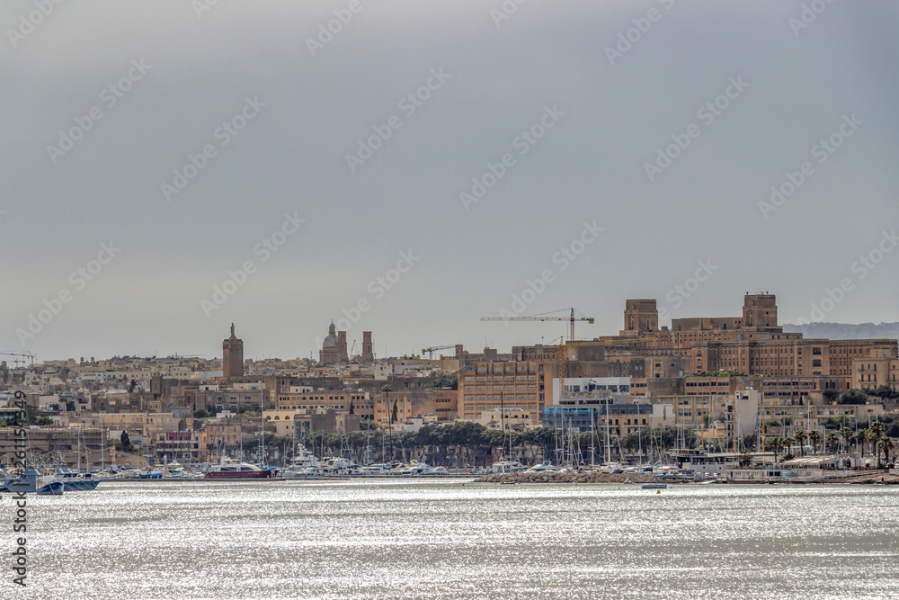 Hazy Mediterranean Sea view of Pieta, Malta, urban skyline