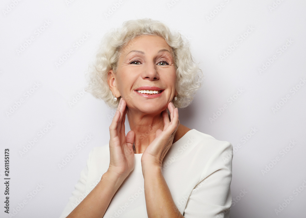 Grey haired old nice beautiful laughing woman. Isolated over vwhite background. Close up.