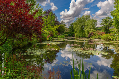 Claude Monet's garden and pond with sky and clouds water reflection in Giverny, France - Image