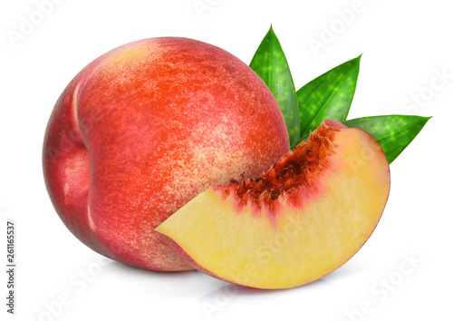 whole and slice of nectarine fruit with green leaves isolated on whitie background photo