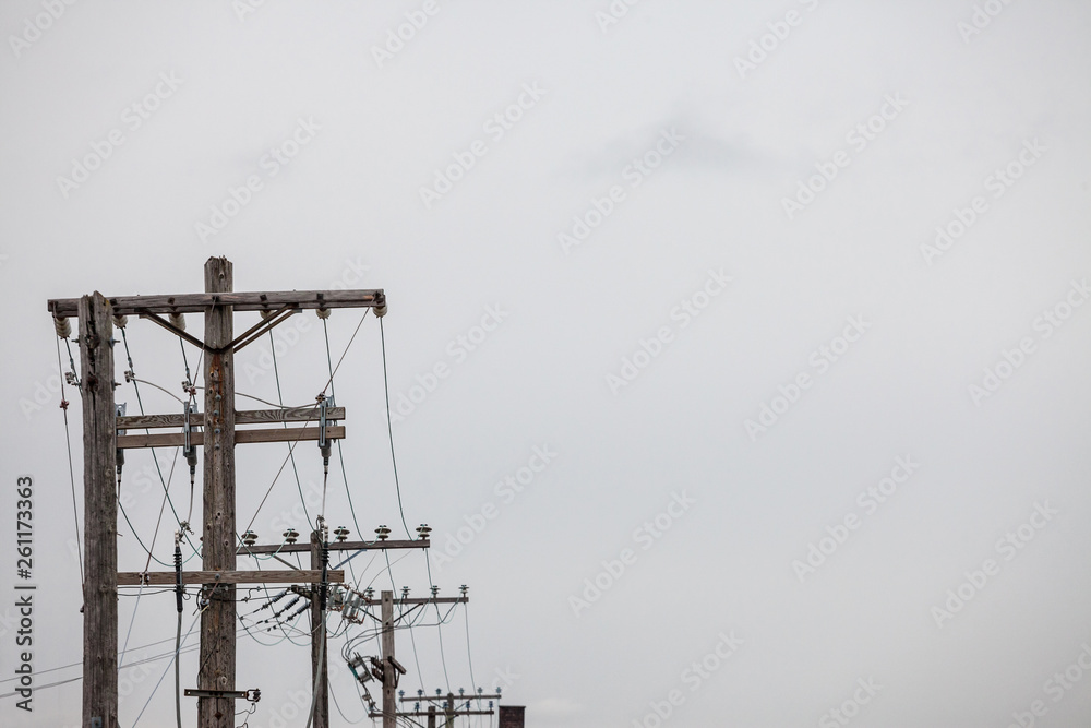 Electric and telephone power line, old and outdated, on a rotten wooden pole, abiding by North American standards, in the city of Ottawa, Ontario, Canada Electric and telephone power line, old and outdated, on a rotten wooden pole, abiding by North American standards, in the city of Ottawa, Ontario, Canada