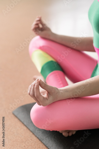 The girl in the hall is studying yoga