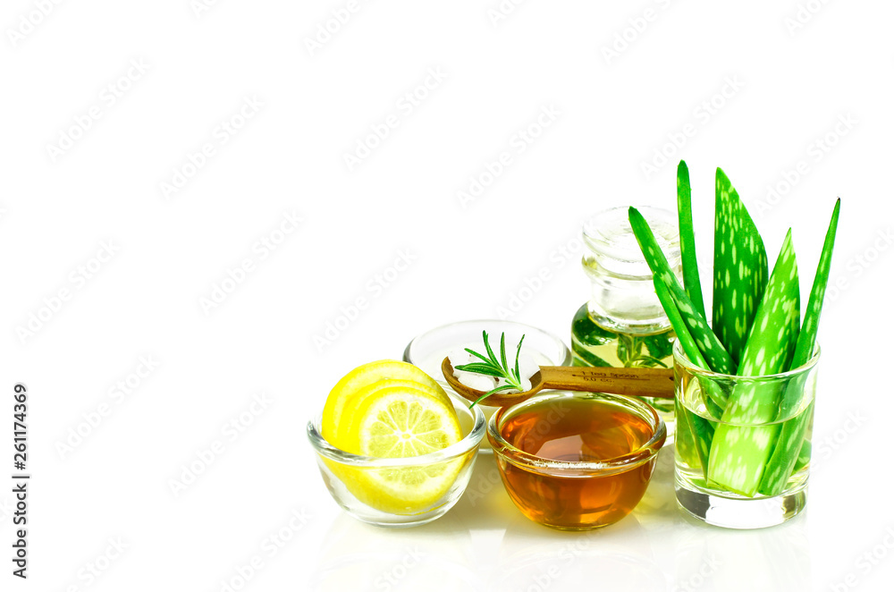 Aloe Vera, Lemon, greek yogurt, honey, rosemary, sea salt and essential oil homeopathy remedy recipe on white background. Aloe Vera, Lemon, greek yogurt, honey, rosemary, sea salt and essential oil homeopathy remedy recipe on white background.