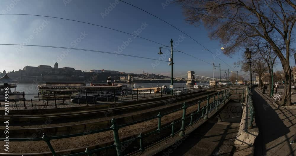 Budapest, Hungary, March 15 jan 2019 Old yellow Tram and Margaret bridge with city traffic at winter. Time lapse Budapest, Hungary, March 15 jan 2019 Old yellow Tram and Margaret bridge with city traffic at winter. Time lapse