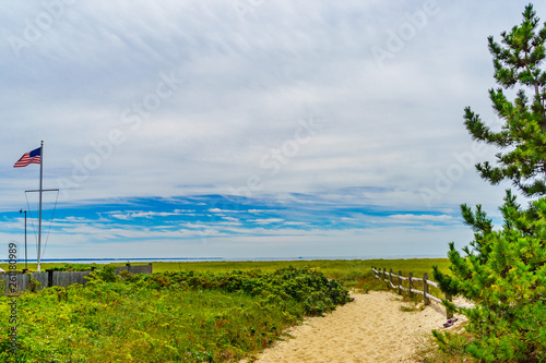 Empty pathway with fence to the beach on a clear summer day in Provincetown, Cape Cod, Massachusetts