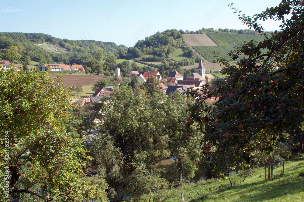 Bavaria Germany, rural village with plowed fields and apple orchards