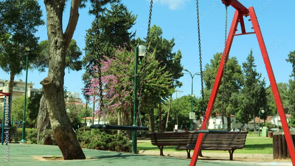 Black empty still swing on kids playground Black empty still swing on kids playground