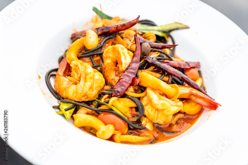 spicy black spaghetti with shrimps (tom yum kung)