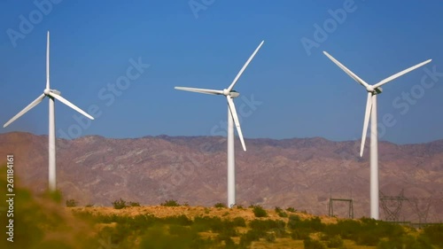 Wallpaper Mural Footage of wind turbines propeller blades in the blue sky. Wind farm and agricultural fields on a summer day. Torontodigital.ca