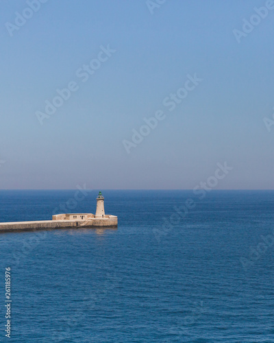 St. Elmo Lighthouse over water in Valletta, Malta