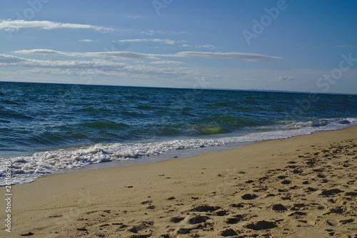 Seashore with blue water and clear sky