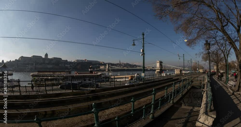 Budapest, Hungary, March 15 jan 2019 Old yellow Tram and Margaret bridge with city traffic at winter. Time lapse Budapest, Hungary, March 15 jan 2019 Old yellow Tram and Margaret bridge with city traffic at winter. Time lapse