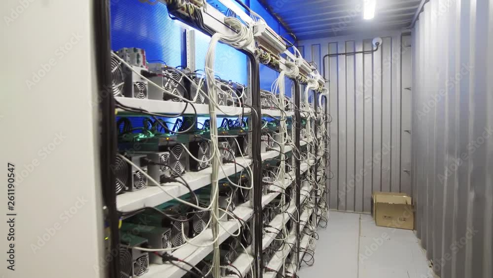 Modern server room for bitcoins mining farms with tens of rows of ...