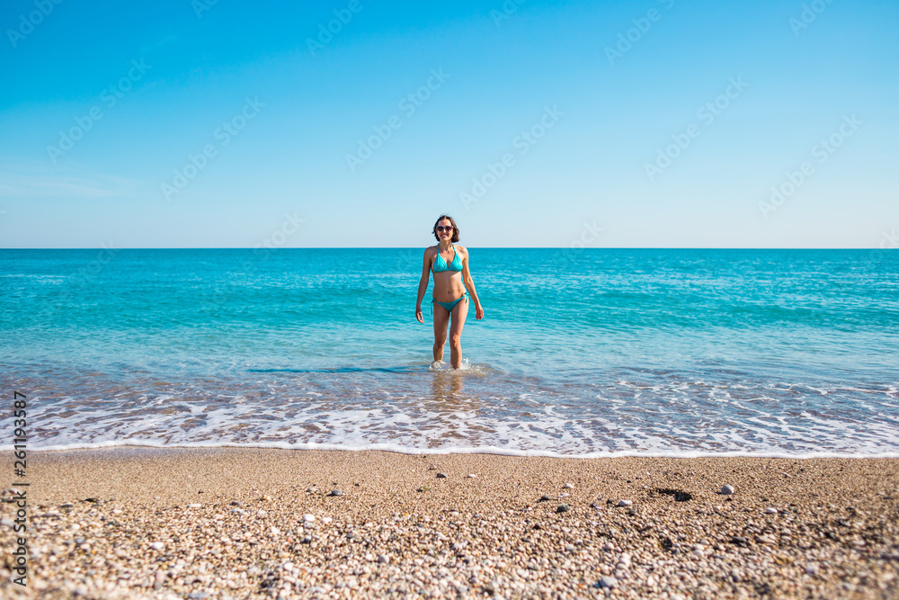 The girl comes out of the water. The girl comes out of the water.