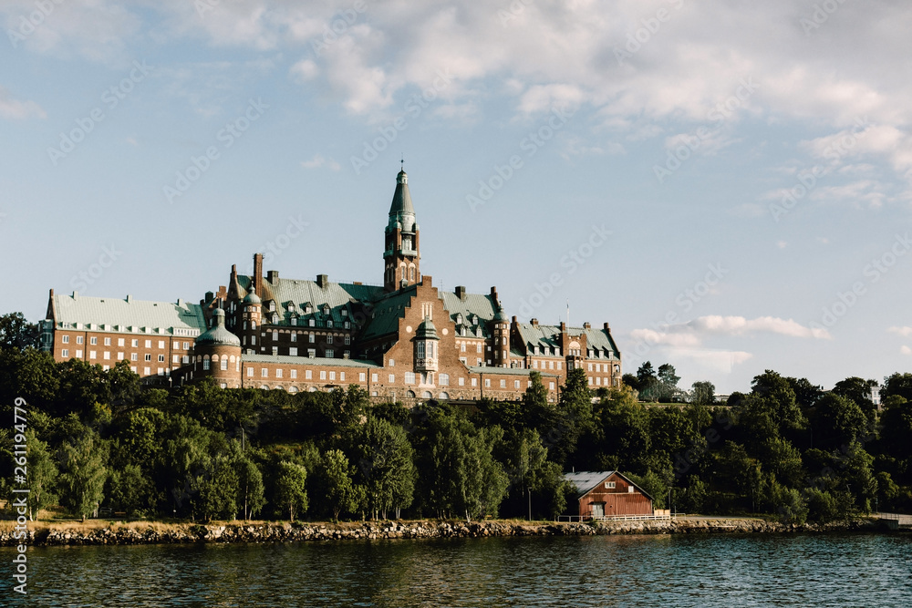 View from a cruise of an old building overlooking the ocean in Stockholm, Sweden