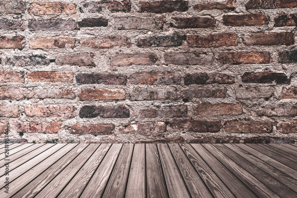 Dark room with brown stone brick wall and wood plank texture background.