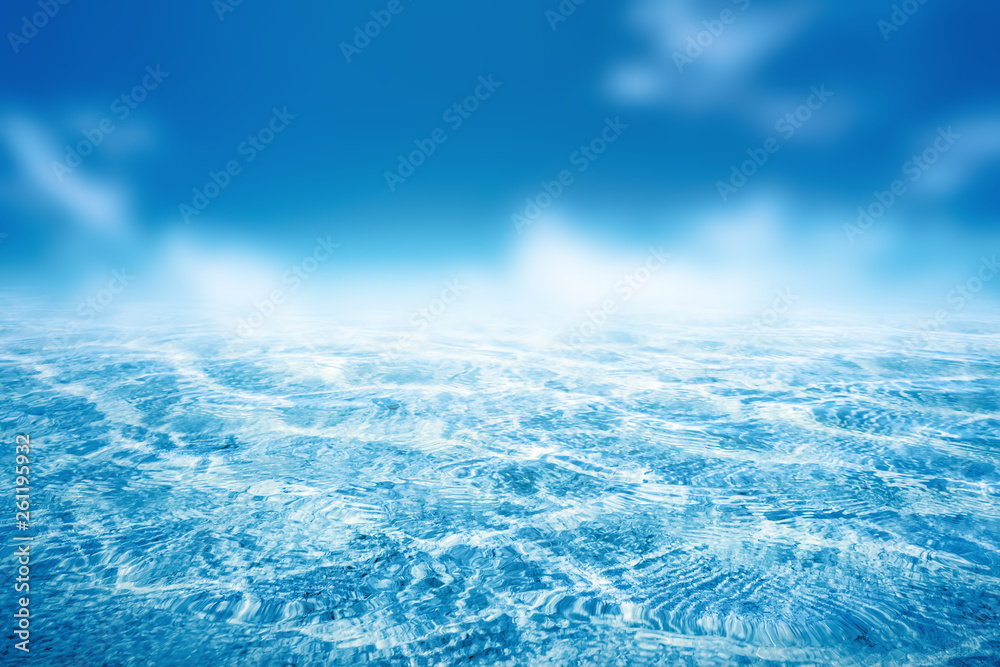 Obraz premium Summer vacation outdoor and travel holiday adventure concept.Copy space tropical ocean smooth wave beach with blue sky and white cloud abstract background.