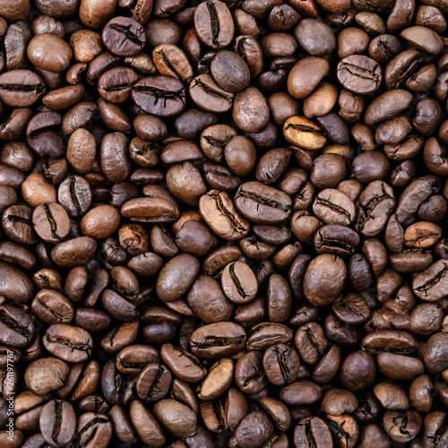 Coffee grains. Background of roasted coffee beans brown. layout. Flat lay.