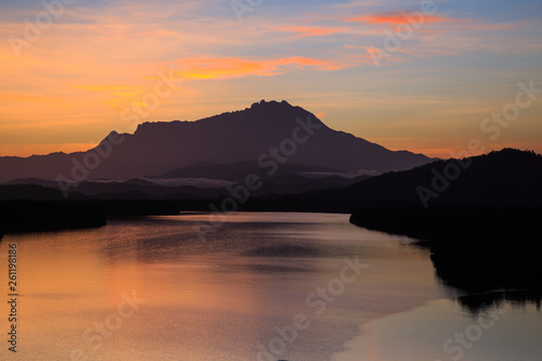 Amazing Beautiful Twilight Sunrise with Rays of light and Mount Kinabalu as background at Gayang, Tuaran, Sabah, Borneo