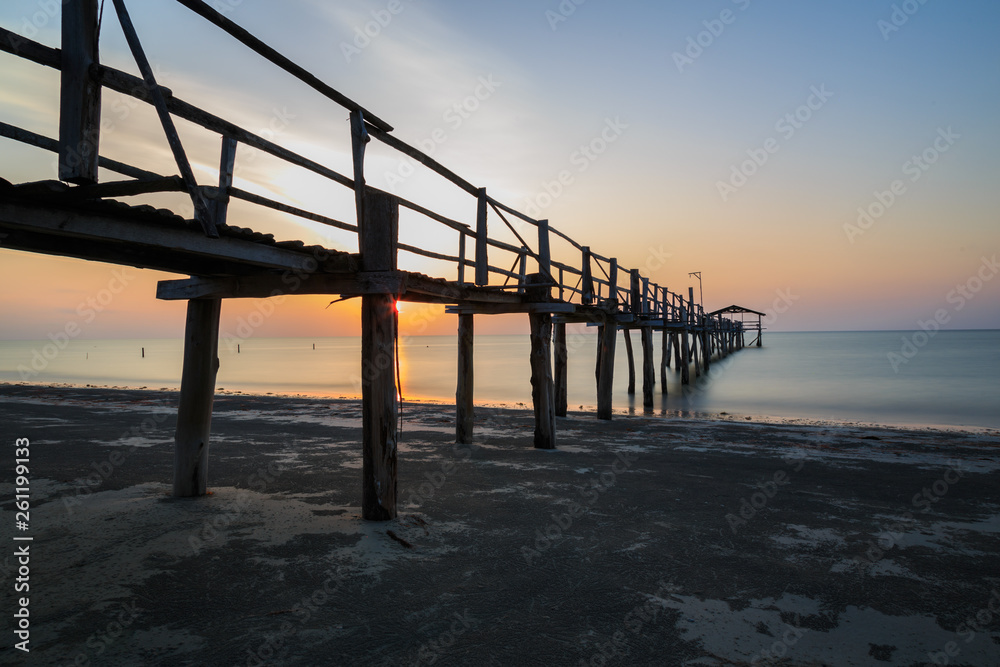 Abstract Old wooden jetty pier long exposure during beautiful sunset