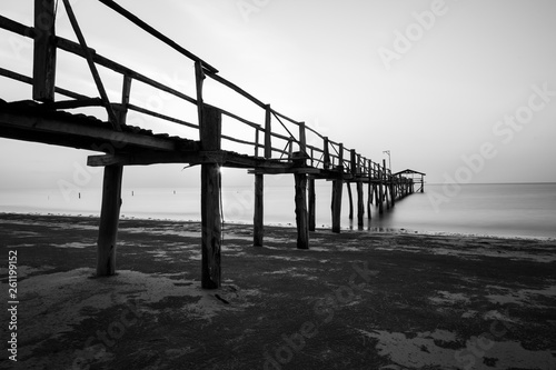 Abstract Old wooden jetty pier long exposure during beautiful sunset