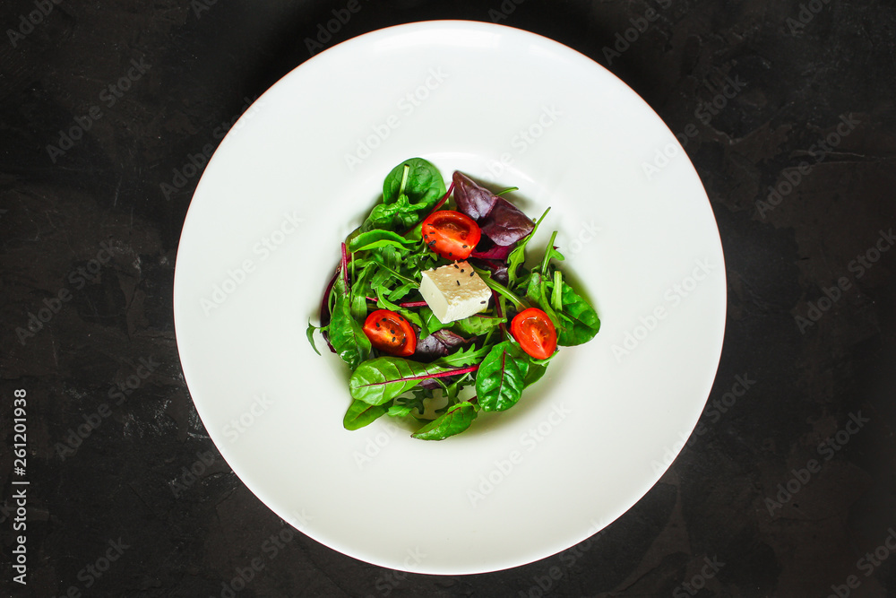 Healthy salad, leaves salad mix in a white plate and cheese (green, juicy snack). food background - Image Healthy salad, leaves salad mix in a white plate and cheese (green, juicy snack). food background - Image