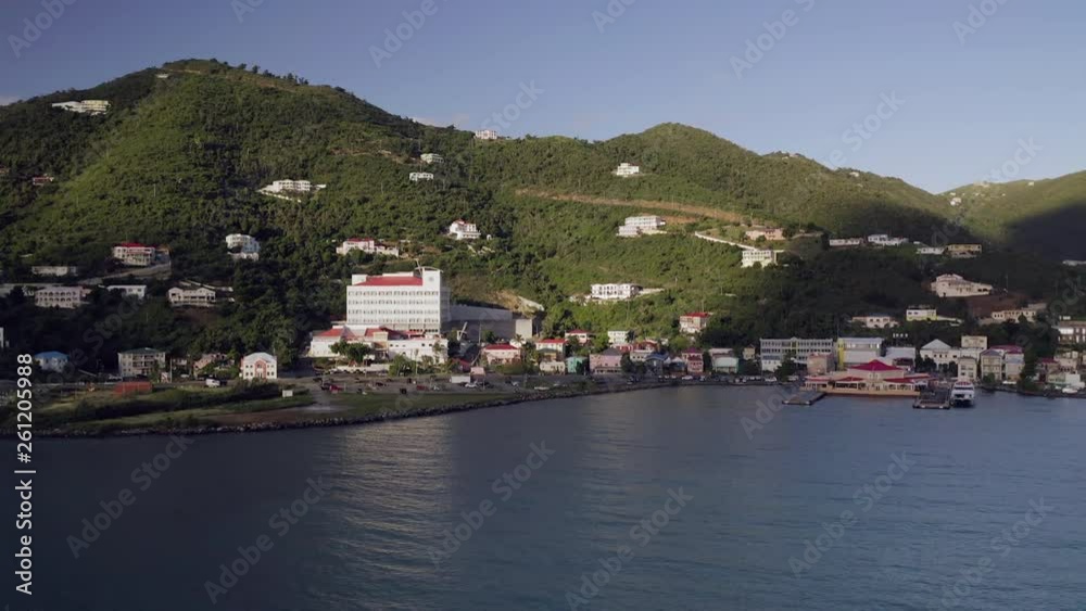 Aerial Pan Right to Left: Coastline with Buildings and Mountain with Homes in San Juan, Puerto Rico Aerial Pan Right to Left: Coastline with Buildings and Mountain with Homes in San Juan, Puerto Rico