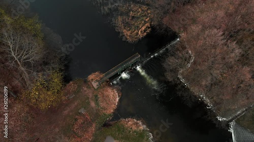 Aerial shot of small dam between lake and river, Aerial shot of dam between Drweca river and Bachotek lake photo
