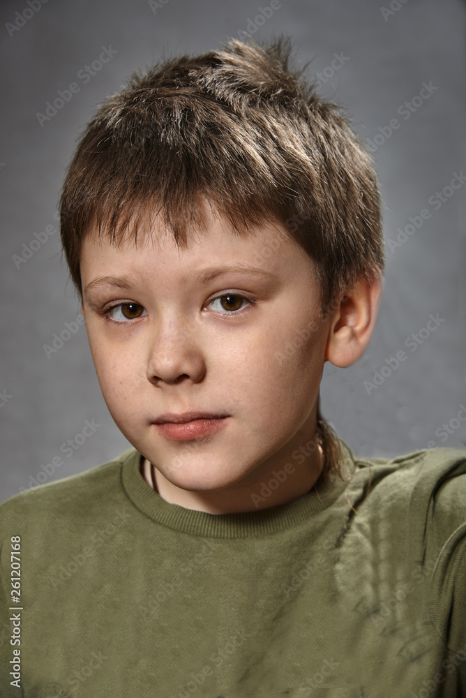 Photo of adorable young happy boy looking at camera. Photo of adorable young happy boy looking at camera.