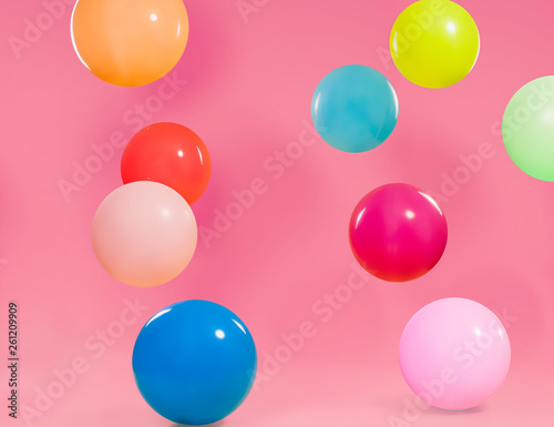 Colorful different balloons with pink background