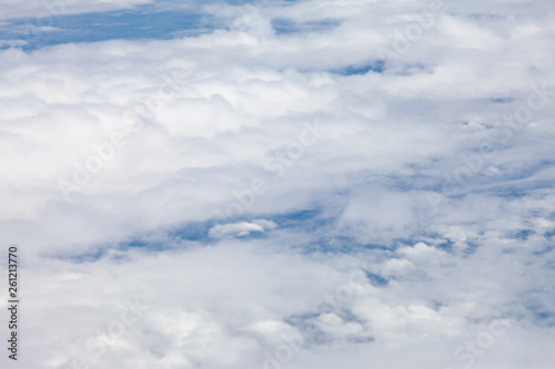 Fototapeta Naklejka Na Ścianę i Meble -  Clouds, sky and ground, looking from the plane.