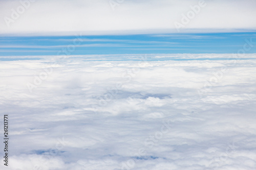 Clouds, sky and ground, looking from the plane. © peterkai