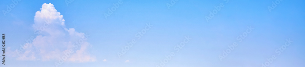 Background of the light blue sky with a white cloud. panorama