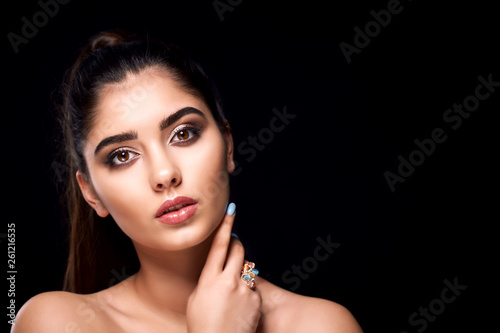 Classic close up vogue beauty portrait with professional make up and hairstyle beautiful girl in studio lights.