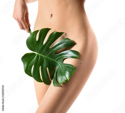 Naked young woman with gree...