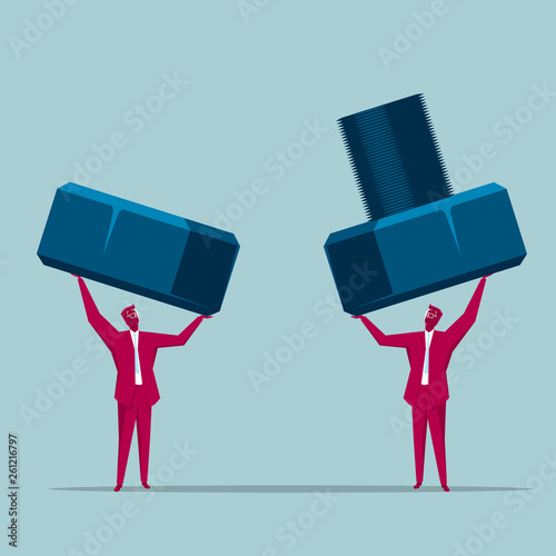 Teamwork concept, businessman lifting bolts. Isolated on blue background.