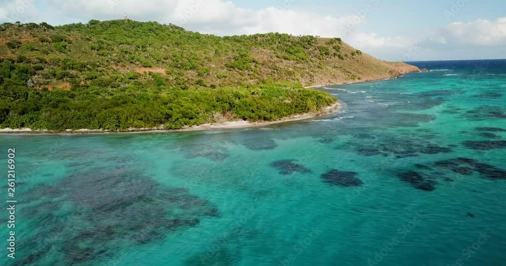 Aerial Forward: Beautiful Island of Saint John Full of Trees and Nature in U.S. Virgin Islands, United States of America