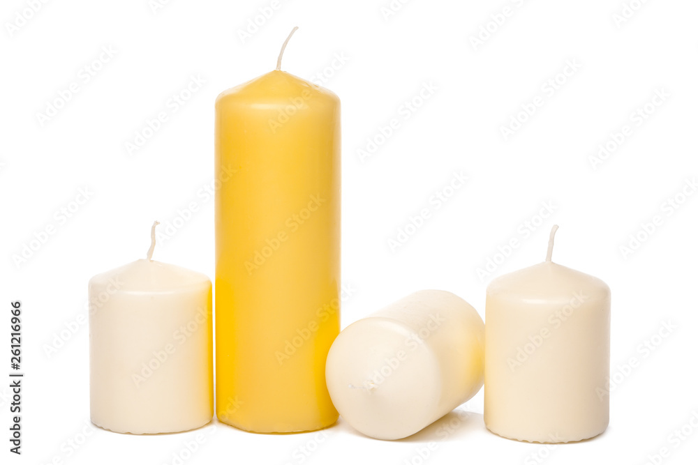 different sized candles on a white background different sized candles on a white background