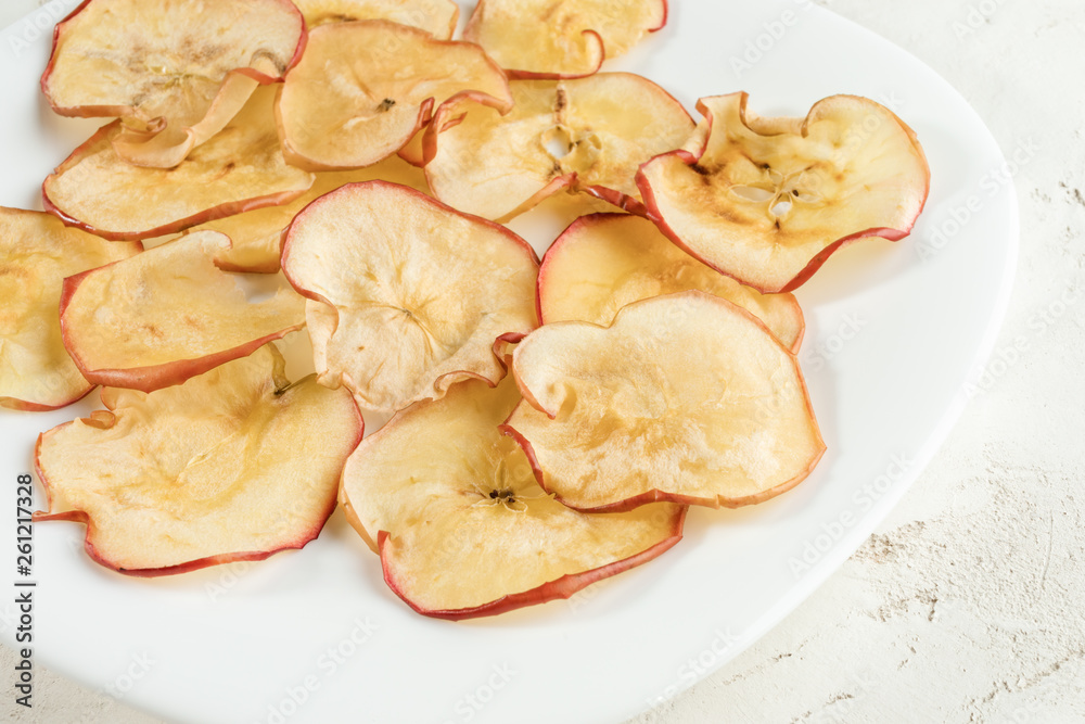 Close-up white plate with dried apple slices.